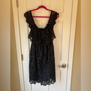 Black dress. Can be work off the shoulder or in the shoulder.